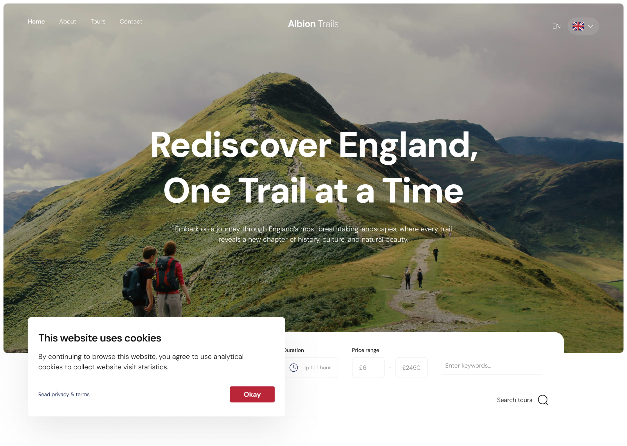 Homepage of a tour service site. Two hikers walk a scenic trail on a lush, green hillside. Text reads - Rediscover England, One Trail at a Time. A cookies notification is visible.